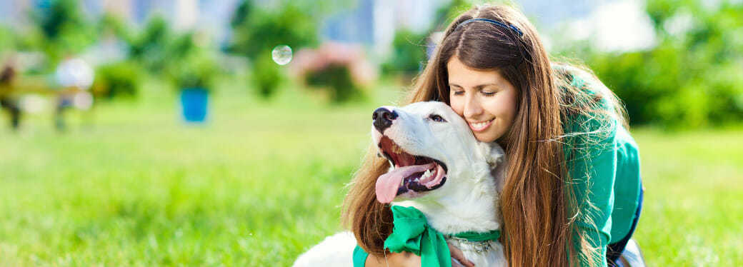 Pet Services Header Brunette Lady Hugging White Dog